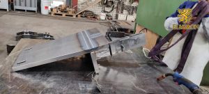 Industrial welding workstation with steel components in fabrication process – Elmiron