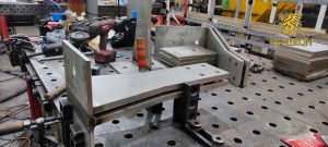 Industrial welding workstation with steel components in fabrication process – Elmiron