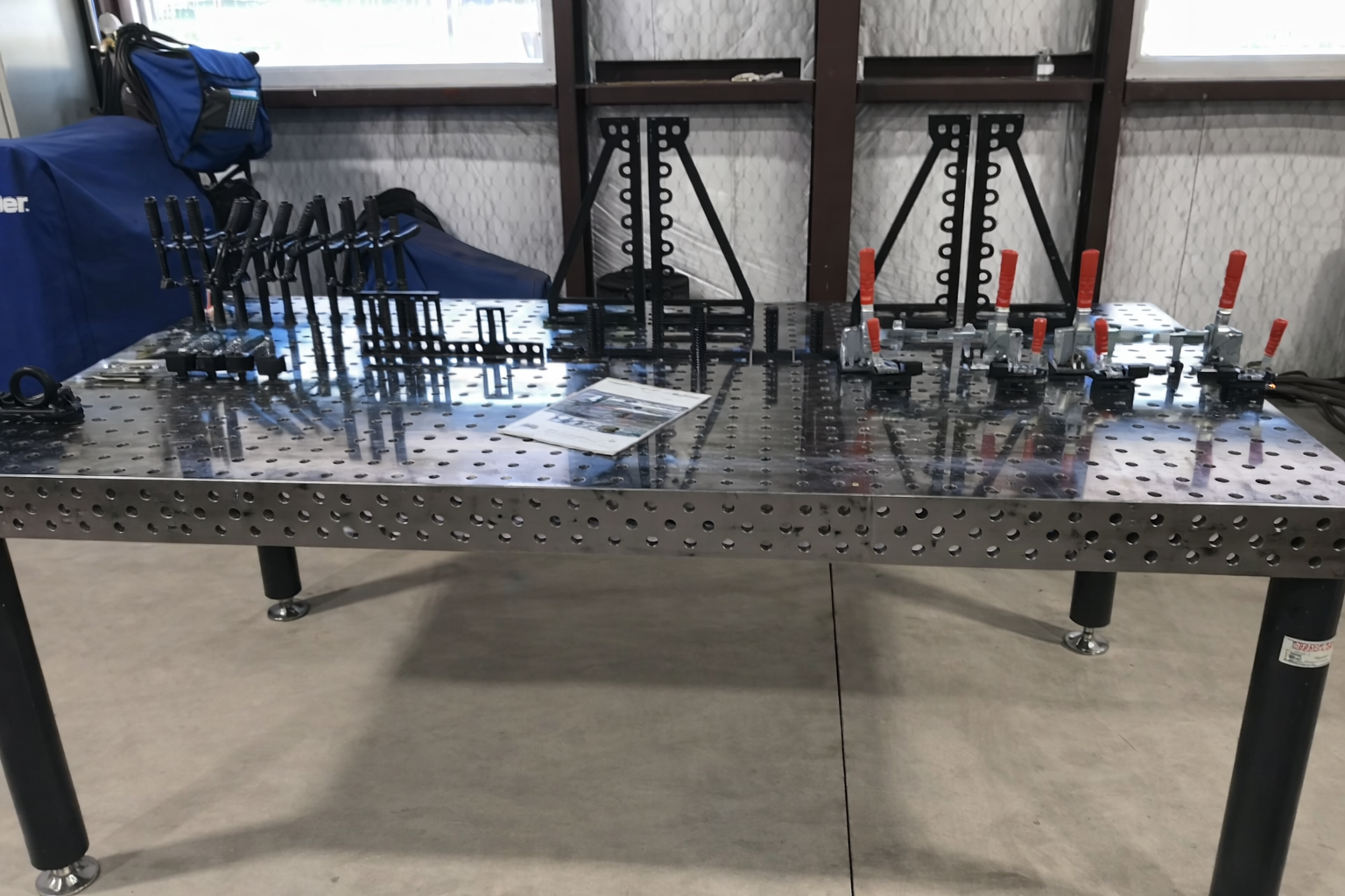 Clamping system on modular 3D welding table in workshop